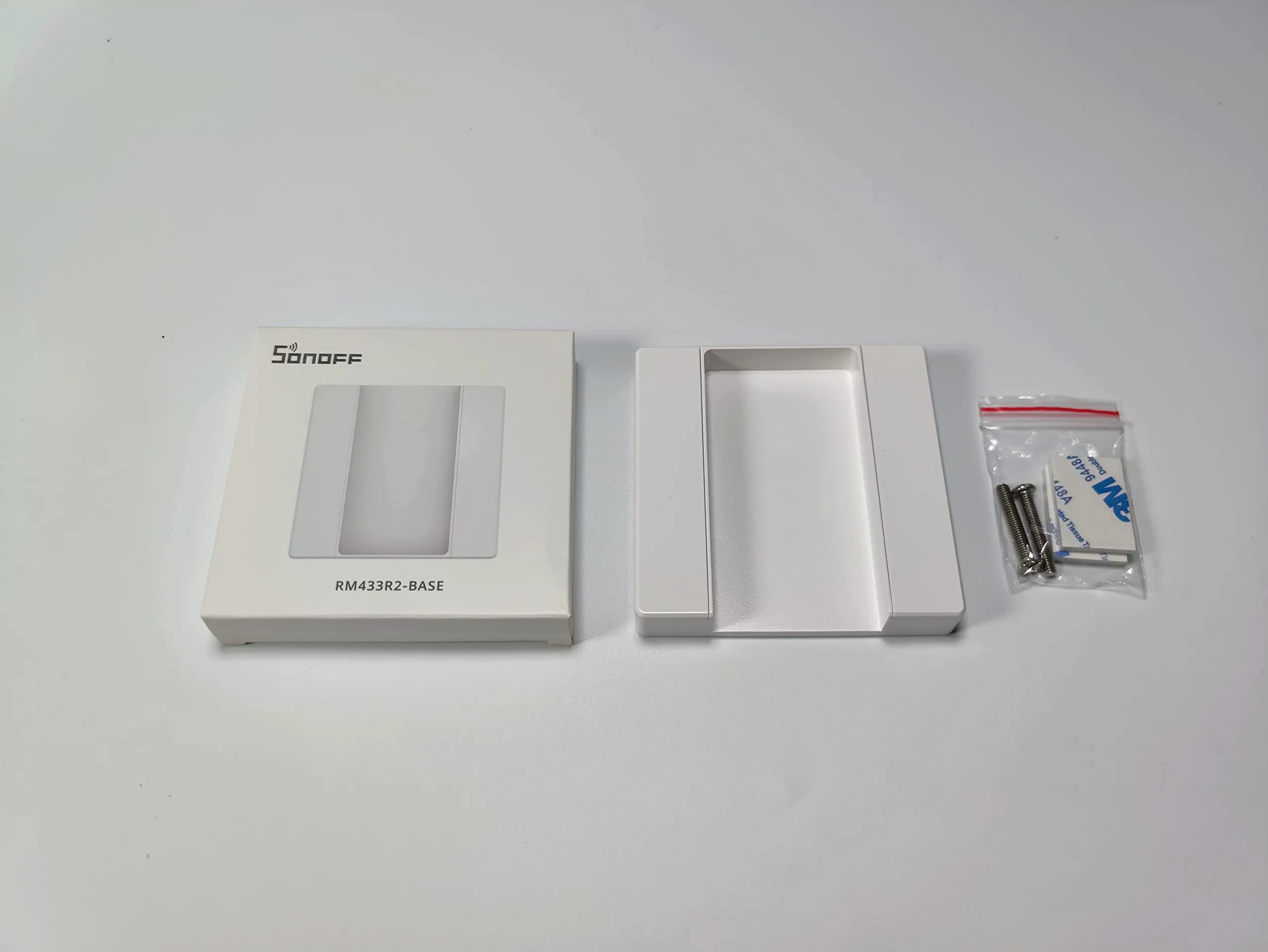 Wall-mounted base for Sonoff RM433 remote control